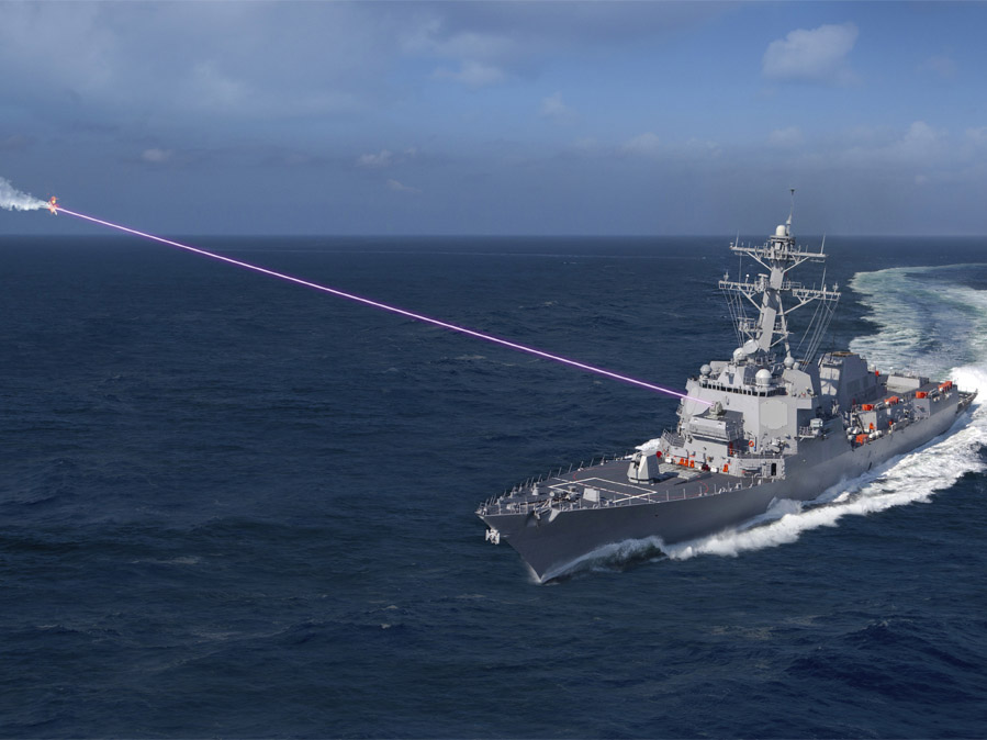 military ship shooting purple laser beam